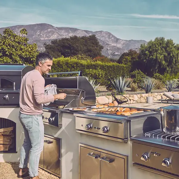 Full outdoor chef kitchen with professional appliances and sink
