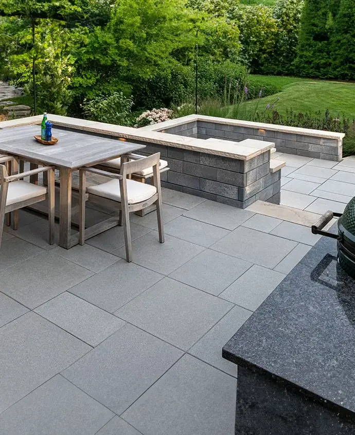 Alt Text: Restored backyard patio with clean joints and protective sealant in a modern landscape