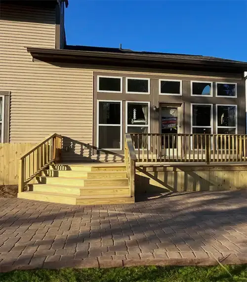 Professional custom deck installation with railings in a Columbus OH backyard